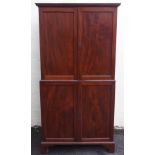 A 19TH CENTURY MAHOGANY COLLECTORS CABINET the dentil cornice above a pair of doors enclosing