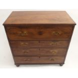 A VICTORIAN MILITARY SECRETAIRE CHEST the hinged sliding door enclosing drawers and pigeon holes,