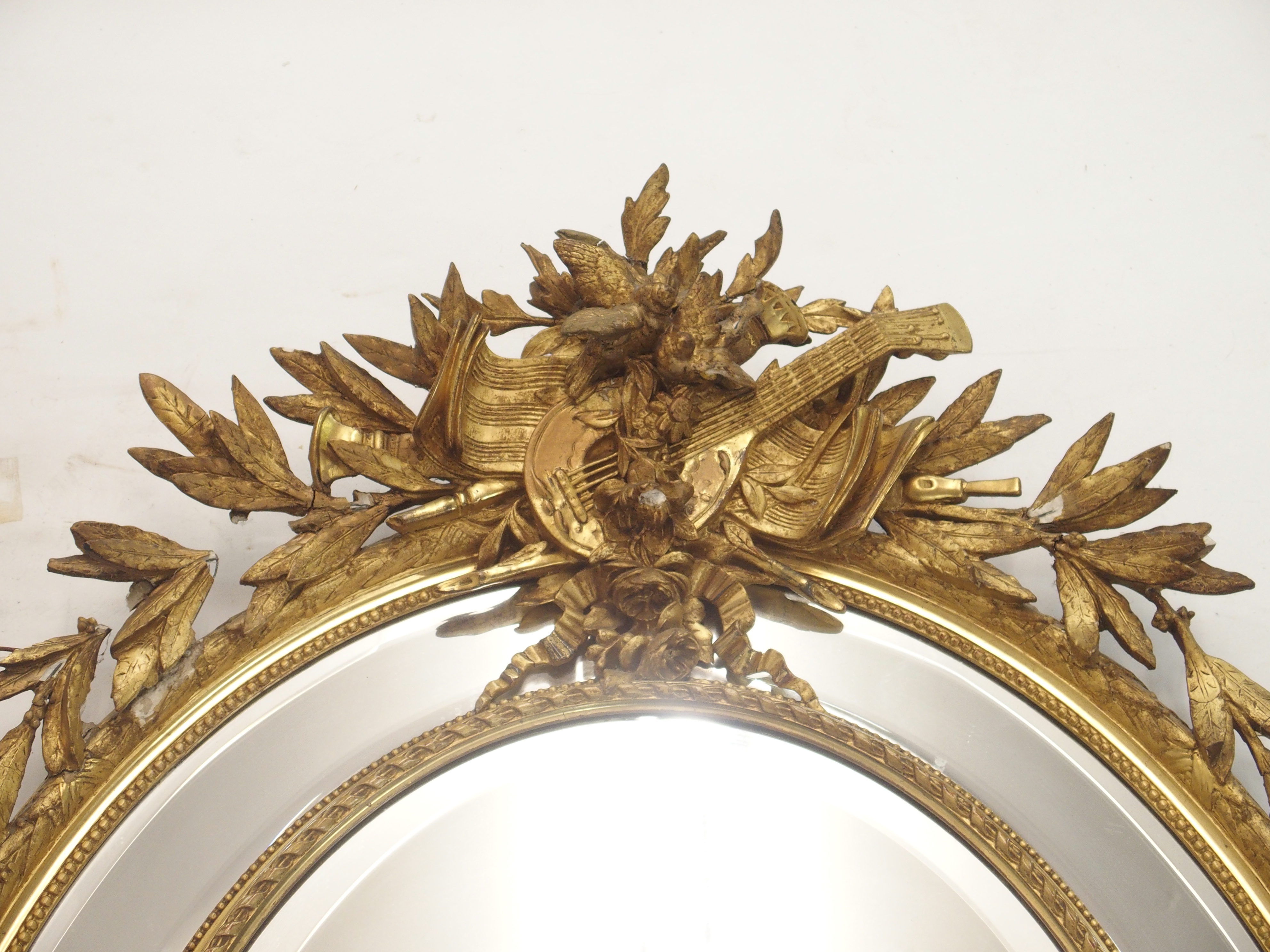 A LOUIS XVI STYLE GILTWOOD AND GESSO OVAL WALL MIRROR with birds and musical trophy surmount above - Image 2 of 12