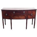 A 19TH CENTURY MAHOGANY BOWFRONT SIDEBOARD with central drawer above a deep drawer flanked by a