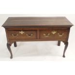 AN 18TH CENTURY OAK DRESSER the ogee moulded top above two drawers and on scallop capped and