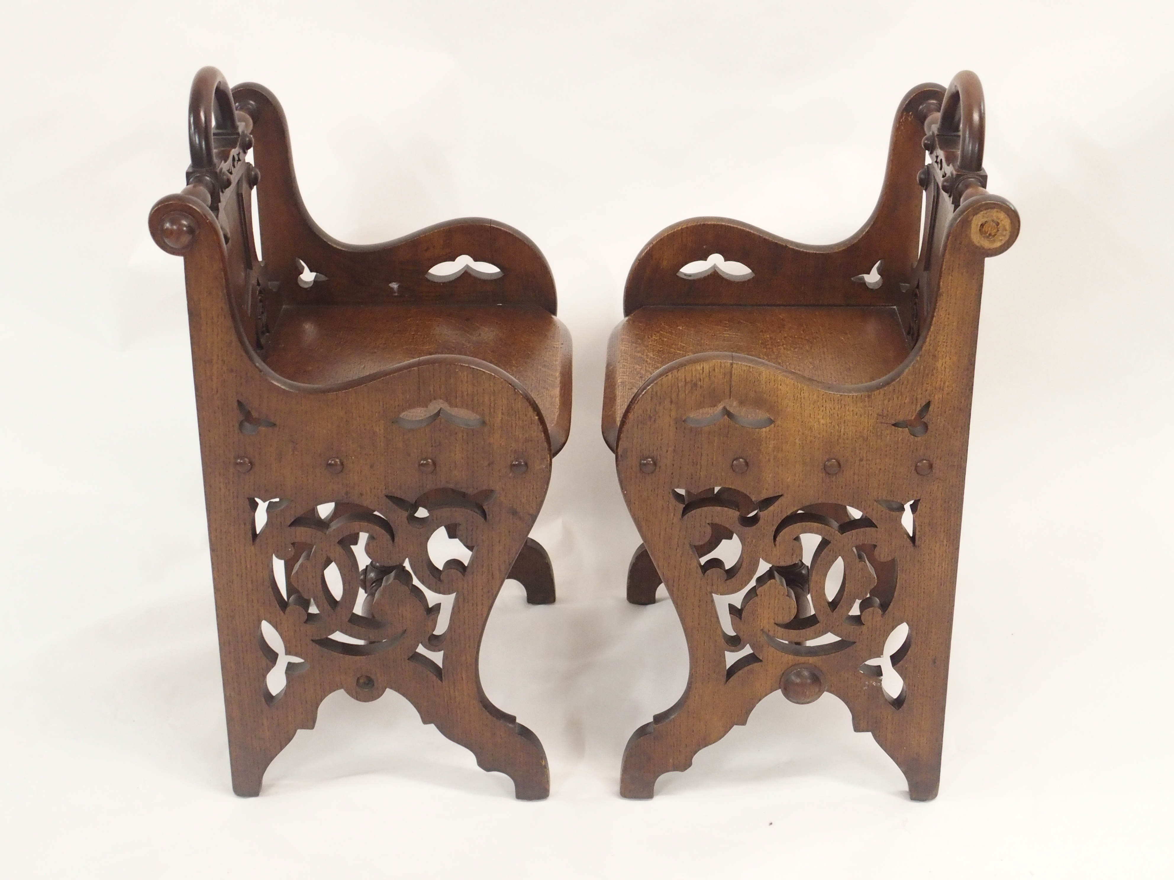 A PAIR OF VICTORIAN OAK HALL CHAIRS each carved with a shield back and pierced scrolls with loop - Image 5 of 12