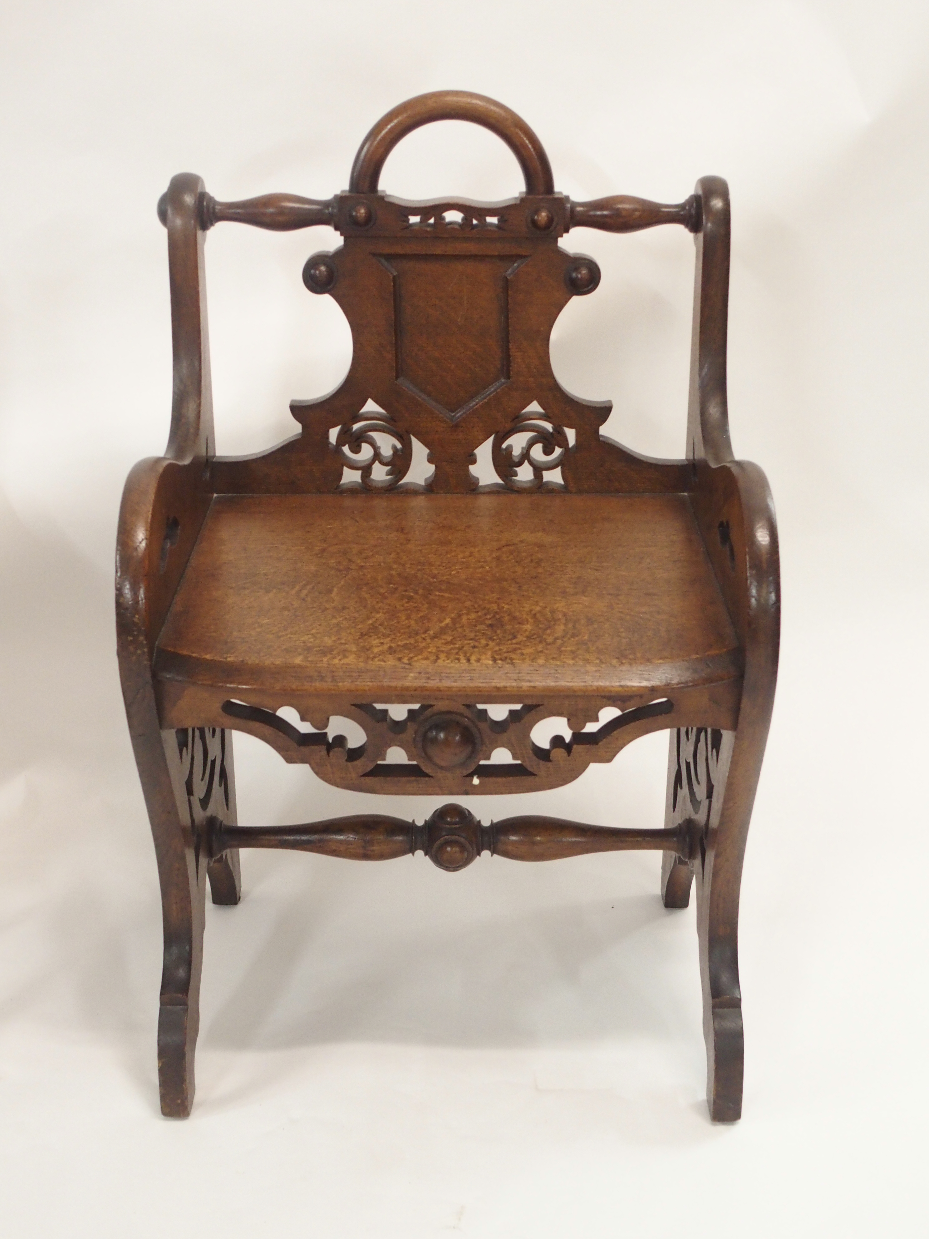 A PAIR OF VICTORIAN OAK HALL CHAIRS each carved with a shield back and pierced scrolls with loop - Image 4 of 12