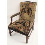 A GEORGIAN STYLE MAHOGANY UPHOLSTERED ARMCHAIR the woolwork covers decorated with Orientals, the