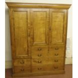 A VICTORIAN HUNGARIAN ASH LINEN PRESS the dentil cornice above a door and pair of doors enclosing