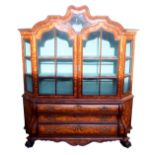 A DUTCH MARQUETRY WALNUT DISPLAY CABINET the scroll shaped hood divided by a glazed panel surrounded