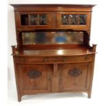 AN ARTS AND CRAFTS MAHOGANY SIDEBOARD the superstructure with a pair of glazed doors above a