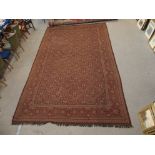 A LARGE RED GROUND RUG WITH GEOMETRIC DESIGN, 450cm x 270cm Condition Report: Available upon