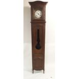 A FRENCH OAK LONGCASE CLOCK the copper embossed face stamped La Rosace with foliate rosette above