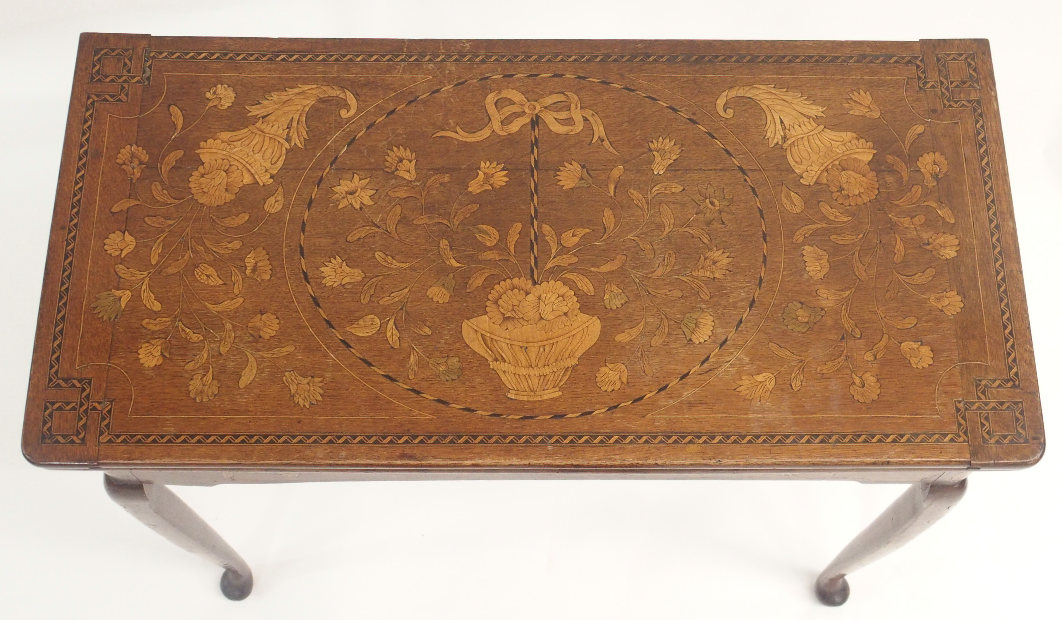 A DUTCH MARQUETRY OAK FOLD OVER CARD TABLE decorated with a basket of ribbon tied flowers, - Image 2 of 10