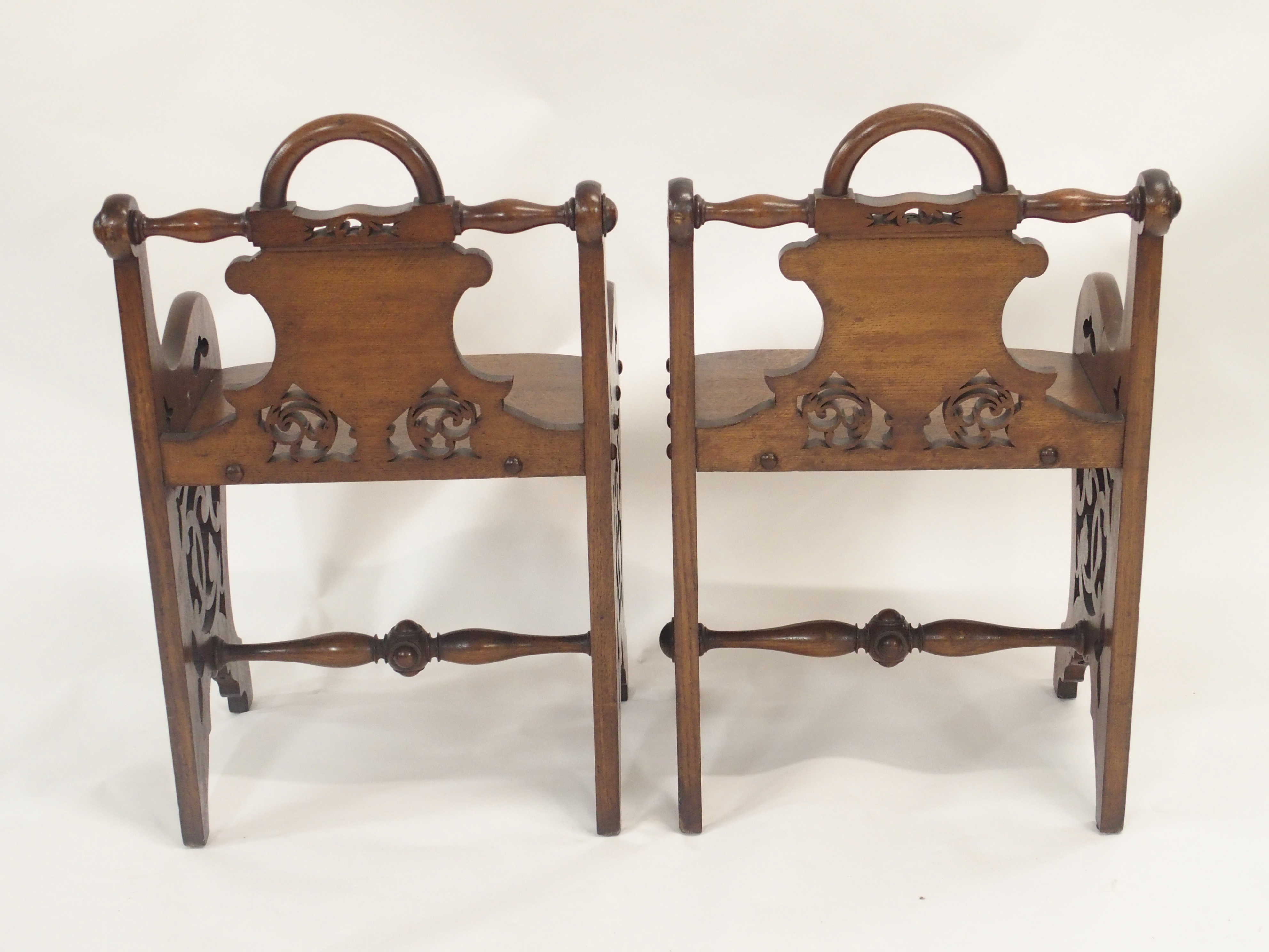A PAIR OF VICTORIAN OAK HALL CHAIRS each carved with a shield back and pierced scrolls with loop - Image 9 of 12