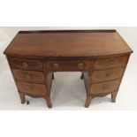 A 19TH CENTURY MAHOGANY AND INLAID BOWFRONT DRESSING TABLE with rail back above a central drawer and