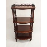 A VICTORIAN WALNUT FOUR TIER WHAT NOT with three-quarter pierced gallery above baluster tapering