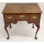 A WALNUT AND CROSSBANDED LOWBOY the moulded top above a rectangular and two square drawers with