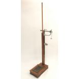 A W & T AVERY OAK FLOOR SCALES, with assorted weights, the main shaft with adjustable height rule,