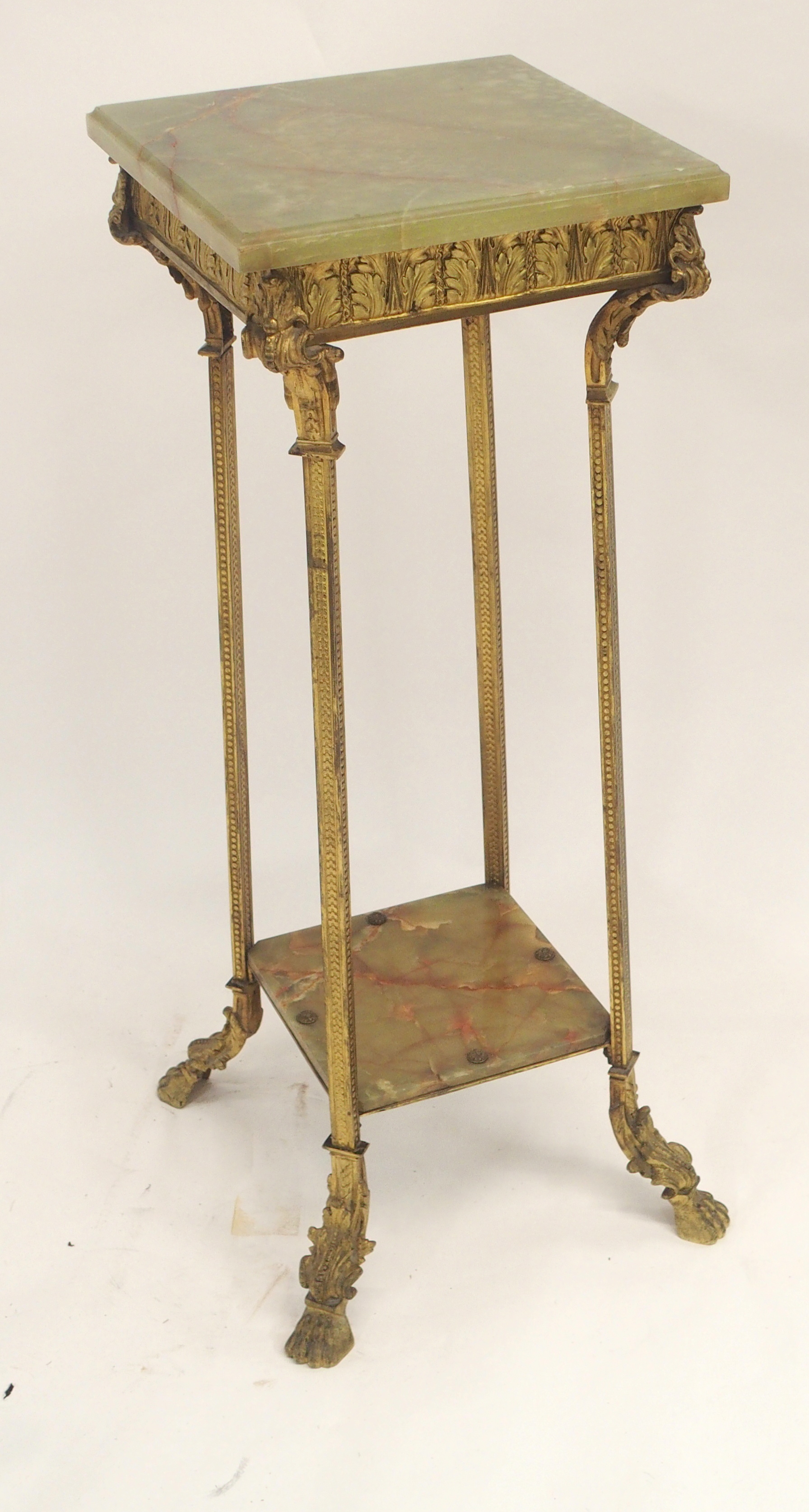 A GILT METAL AND GREEN ONYX PEDESTAL cast with acanthus leaf and on square legs joined by a shelf