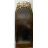 A SCOTTISH ARTS AND CRAFTS BRASS FRAMED MIRROR with repousse decoration of pine cones and pine