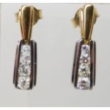 A PAIR OF 18CT GOLD DIAMOND DROP EARRINGS in yellow and white gold, set with 0.50cts of brilliant