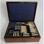 A SEVENTY NINE PIECE SILVER PLATED CUTLERY SET by Walker & Hall, in oak canteen Condition Report: