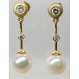 A PAIR OF 18CT GOLD PEARL AND DIAMOND DROP EARRINGS pearls approx 8.1mm, length of drop 2.7cm,