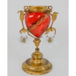 AN ANTIQUE FRENCH GLASS AND GILDED BRASS SACRED HEART VASE the red glass body with metal thorns