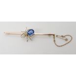 A 9CT GOLD GEM SET SPIDER BROOCH set with a blue paste stone and faux pearl, length 7.7cm, weight