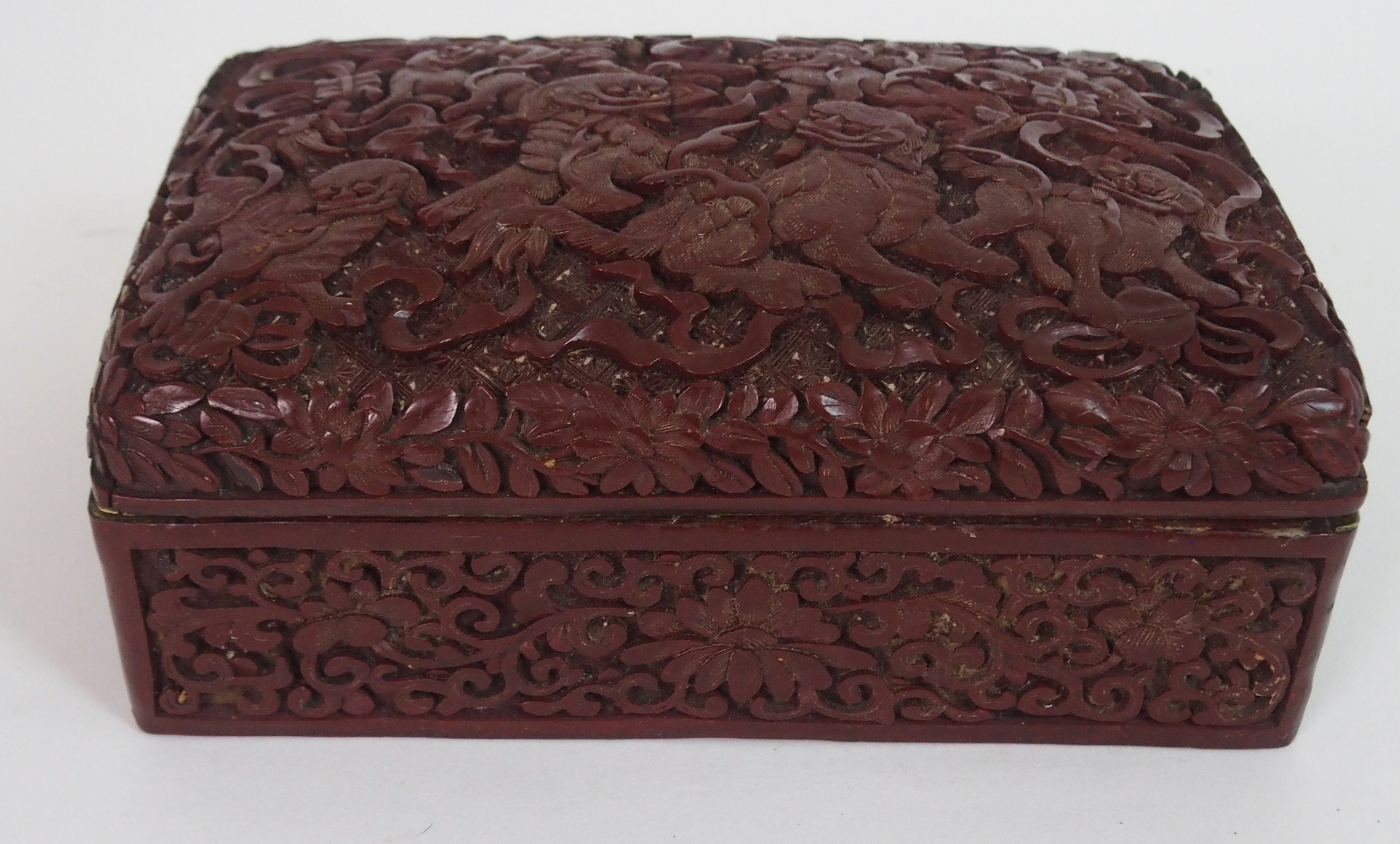 A CHINESE CINNABAR BOX AND COVER carved with kylin with precious objects and ribbons, above - Image 2 of 4