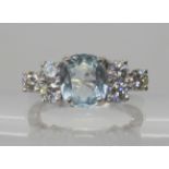 AN 18CT WHITE GOLD AQUAMARINE AND DIAMOND RING the central cushion cut aquamarine measures