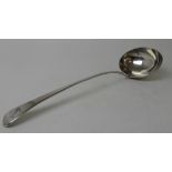A SILVER SOUP LADLE by Wiliam Eley, London marks with oval bowl and plain stem bear a crest, 24cm
