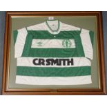 A GREEN AND WHITE CELTIC SHORT-SLEEVED SHIRT with button-up collar and embroidered badge,