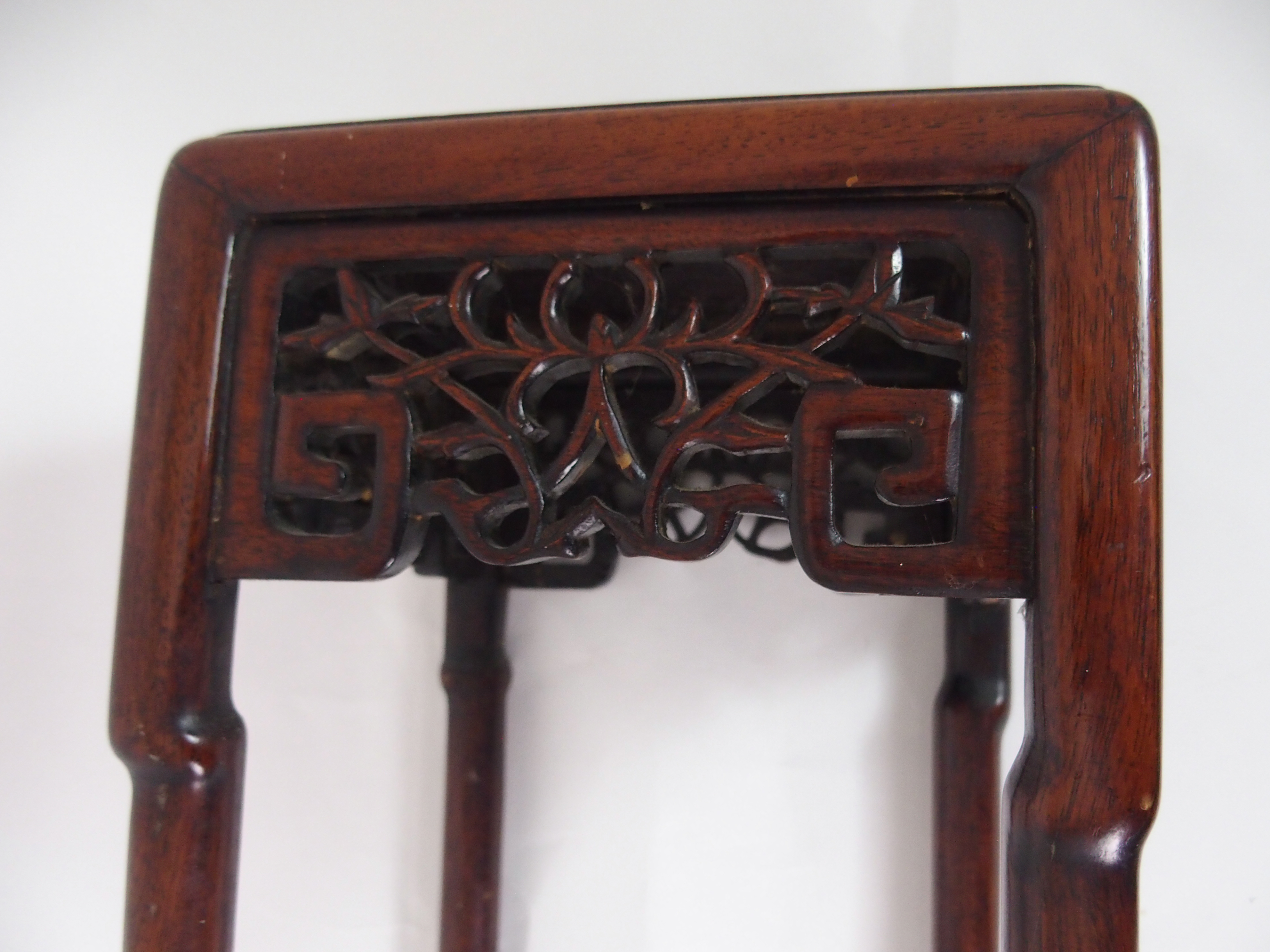 A CHINESE HARDWOOD VASE STAND the square top above foliate and key pattern frieze and on slender - Image 3 of 7