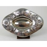 AN ARTS AND CRAFTS HAMMERED SILVER DISH by Gilbert Marks, London 1906, navette shaped, finely chased