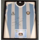 A BLUE AND WHITE ARGENTINA REPLICA SHIRT the front autographed by Diego Mardona, with certificate of