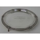 A SILVER SALVER by Brook & Son, Edinburgh 1936, or circular form, the edge with a band of Celtic