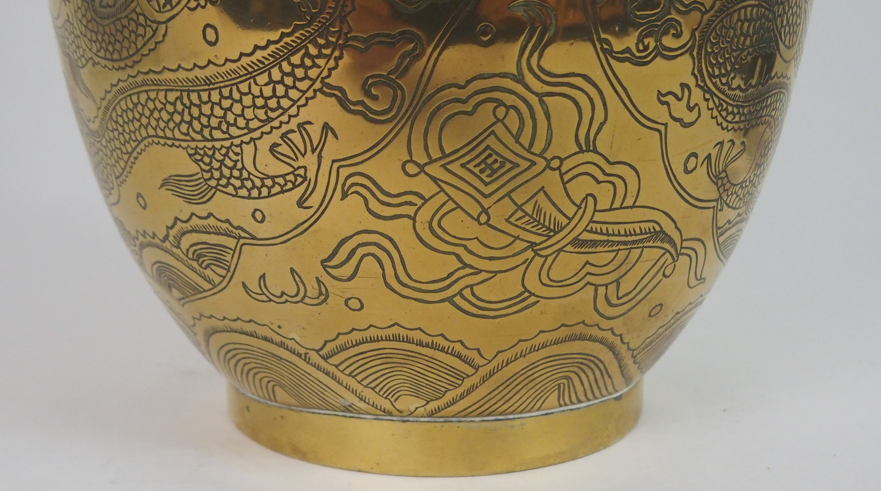 A CHINESE BRASS BALUSTER VASE cast with a dtragon wraped around the neck and above panels of dragons - Image 6 of 8