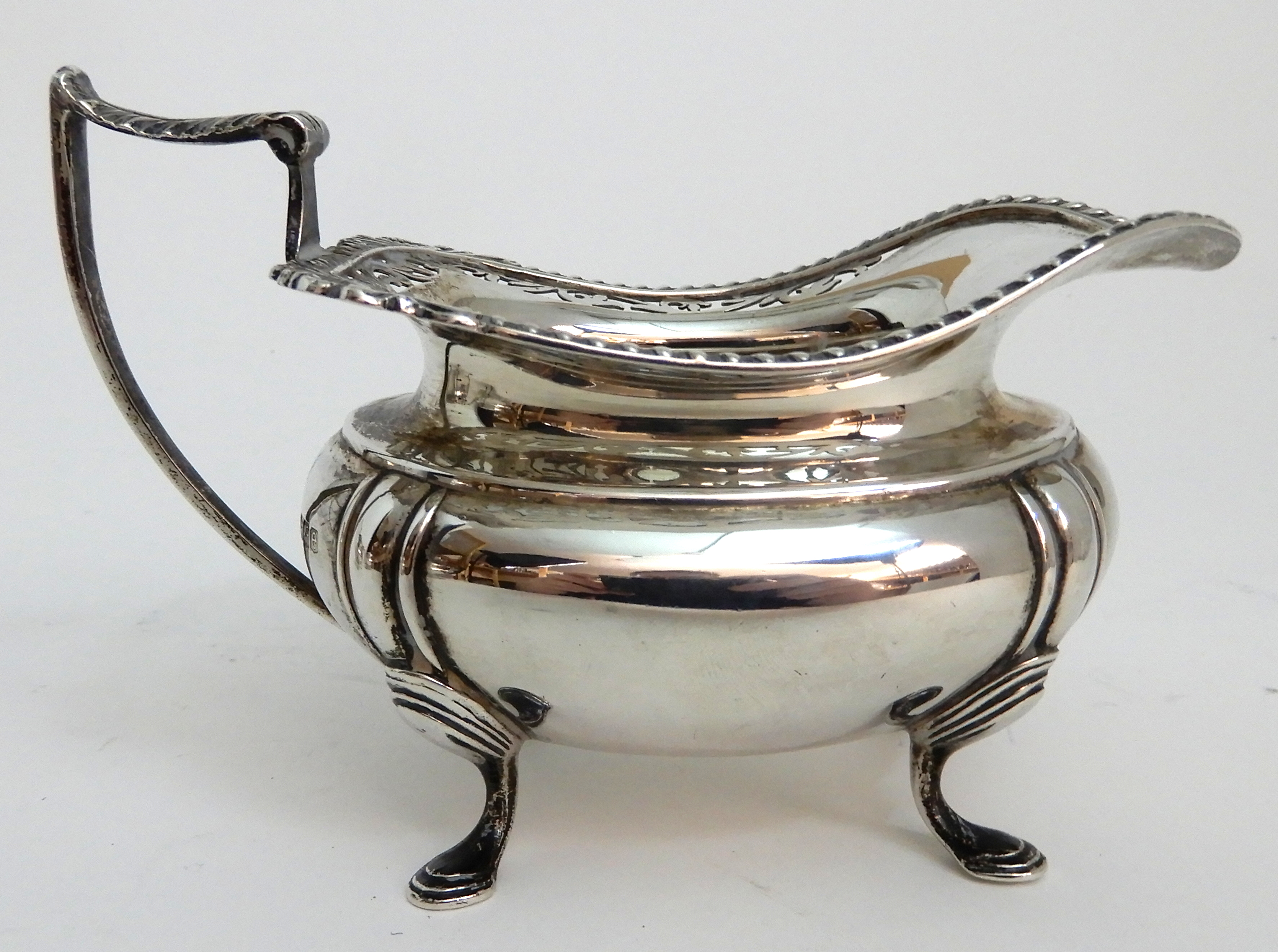 A THREE PIECE SILVER TEA SERVICE by James Deakin & Son, Sheffield 1919, of rounded rectangular - Image 9 of 10