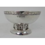 EDWARD SPENCER (1872 - 1938) FOR THE ARTIFICERS GUILD, LONDON an Arts and Crafts hammered silver
