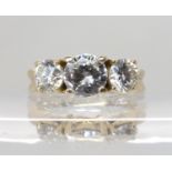 AN 18CT YELLOW GOLD THREE STONE DIAMOND RING set with three brilliant cut diamonds with an estimated