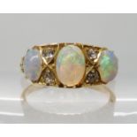 AN 18CT GOLD OPAL AND DIAMOND RING hallmarked Birmingham 1905, largest opal approx 7mm x 5mm x 2.