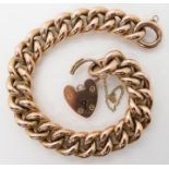 A 9CT ROSE GOLD CURB LINK BRACELET with heart shaped clasp, stamped 9c to the clasp and every