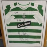 A GREEN AND WHITE REPLICA CELTIC SHORT-SLEEVED SHIRT the front bearing numerous player autographs