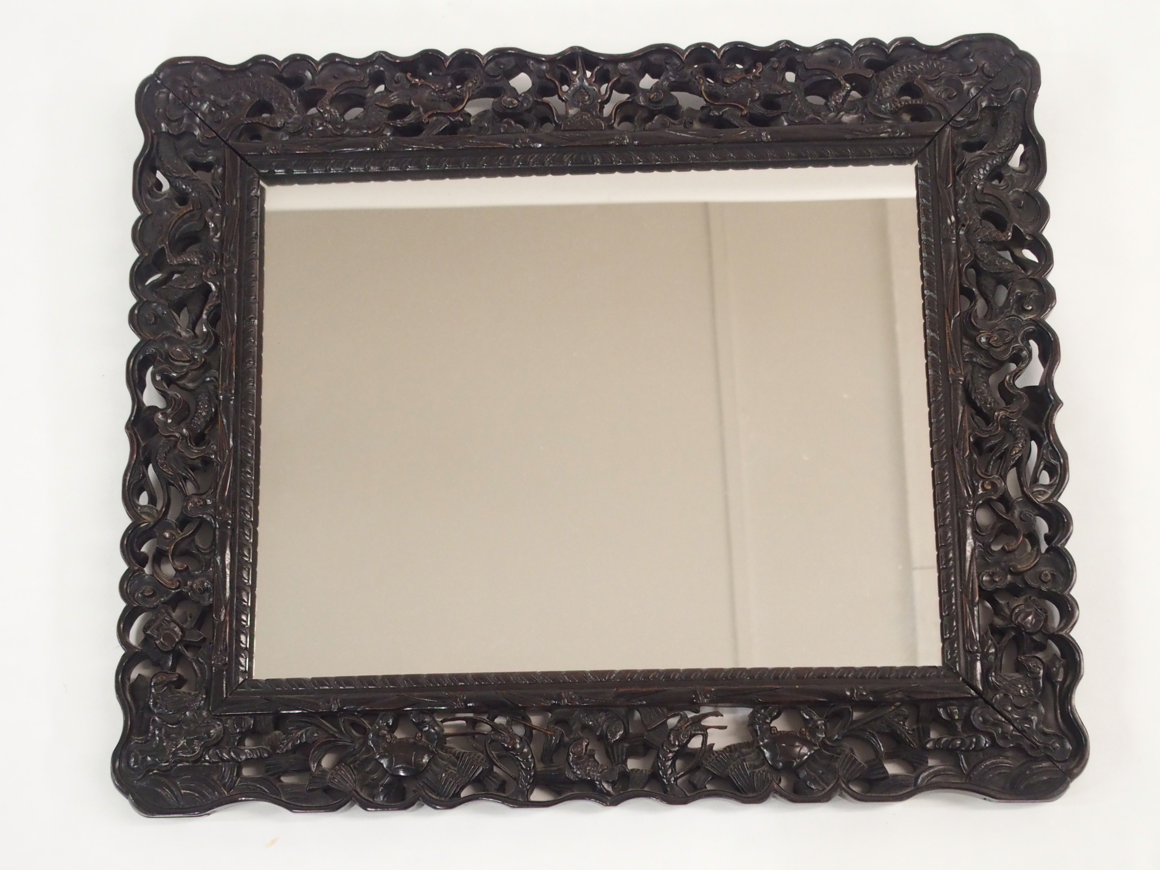 A CHINESE HARDWOOD WALL MIRROR the pierced frame carved with dragons chasing the flaming pearl of - Image 3 of 7