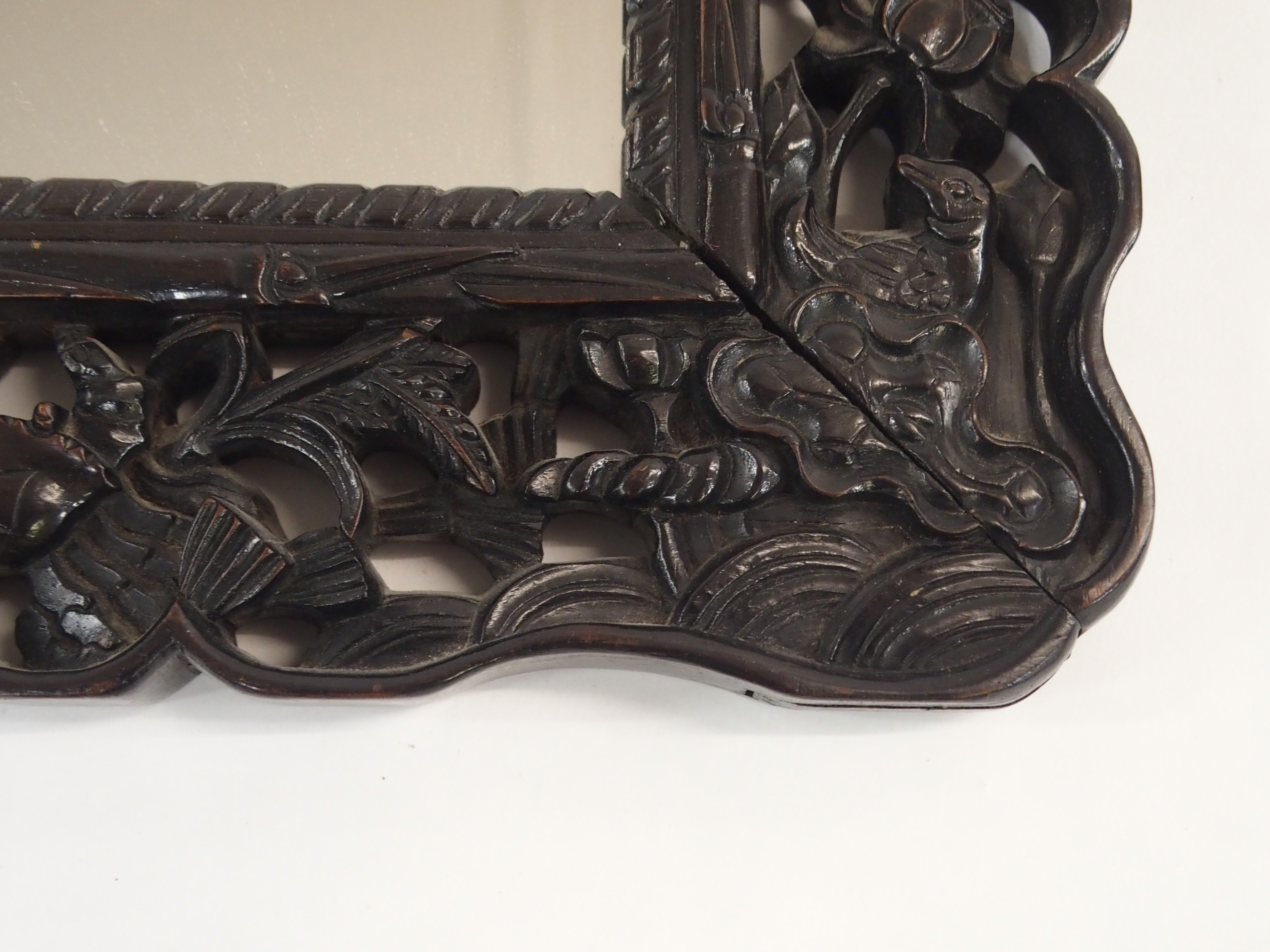 A CHINESE HARDWOOD WALL MIRROR the pierced frame carved with dragons chasing the flaming pearl of - Image 4 of 7