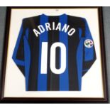 A BLUE AND BLACK INTER MILAN SHIRT No.10, the reverse lettered Adriano, also autographed by Adriano,