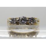 A RETRO THREE STONE DIAMOND RING set with estimated approx 0.40cts of brilliant cut diamonds