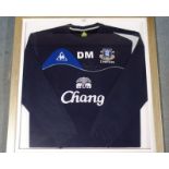 AN EVERTON SWEATSHIRT letter DM, also autographed by David Moyes, framed and glazed, 80 x 77cm