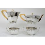 A FOUR PIECE SILVER TEA SERVICE by Emile Viner, Sheffield 1947, of tapering faceted form with