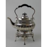 A SILVER SPIRIT KETTLE by Walker & Hall, Sheffield 1919, of curving rectangular form, with half