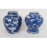 A CHINESE BLUE AND WHITE GINGER JAR AND COVER painted with blossoming branches, four character mark,