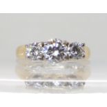 AN 18CT GOLD THREE STONE DIAMOND RING set with estimated approx 1.14cts of brilliant cut diamonds,